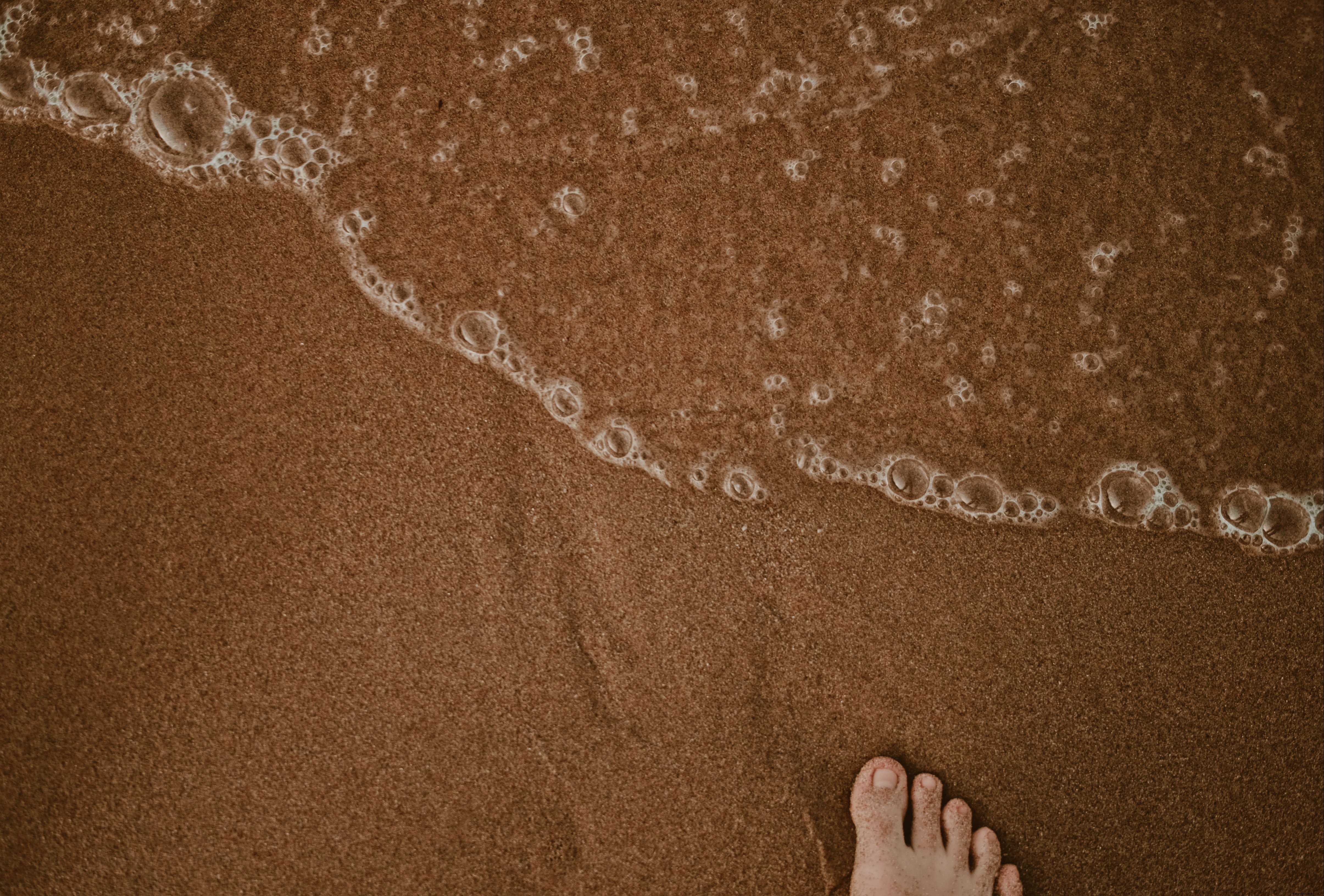 Pieds dans le sable – Photo de plage