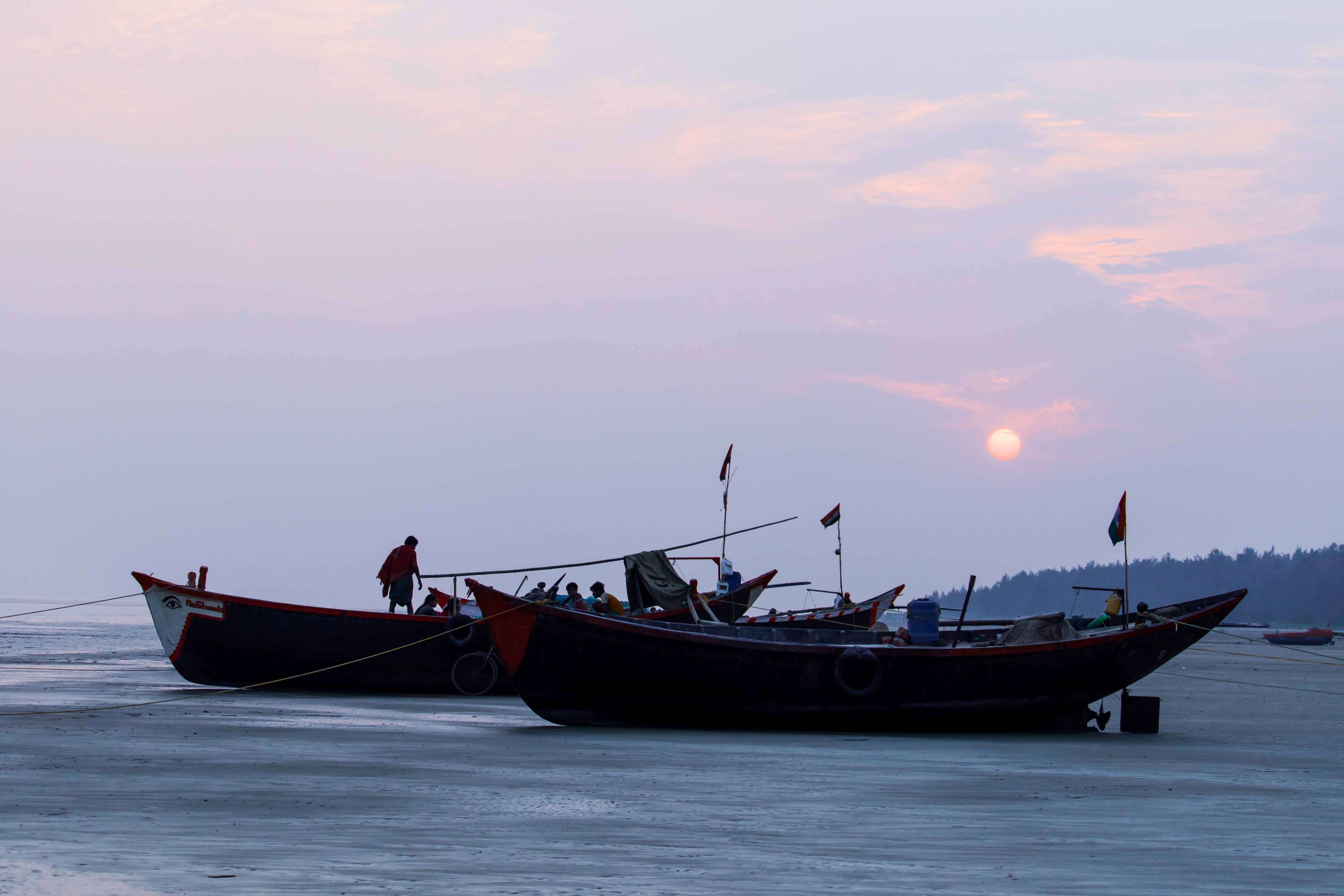 Photos de bateaux de pêche au bord du rivage